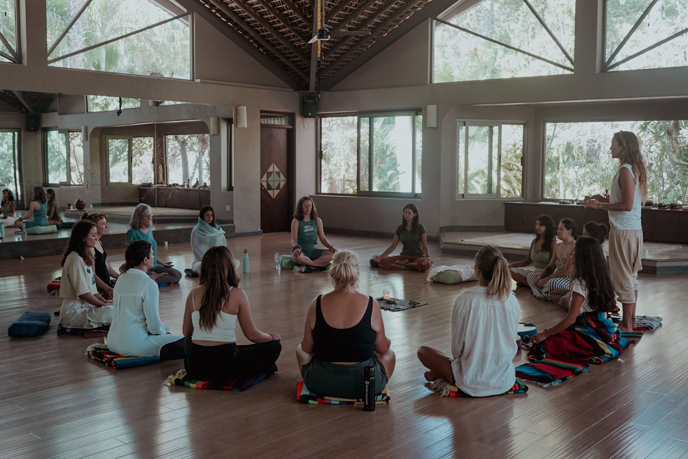 Circle gathering in a light-filled studio